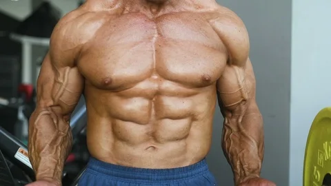 Brutal aged strong bodybuilder athletic men pumping up muscles with dumbbells Vídeos de archivo 90968718