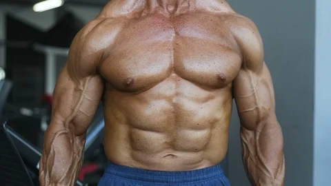 Brutal aged strong bodybuilder athletic men pumping up muscles with dumbbells Video stock 90968720