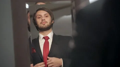 Brutal bearded bride dressed in a beautiful wedding day. A man adjusts his 스톡 동영상 68928514