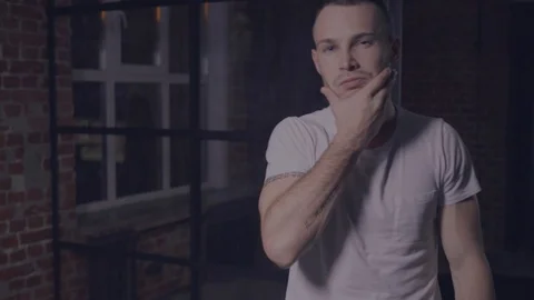 Brutal guy looking at the camera Stock Footage 105565825