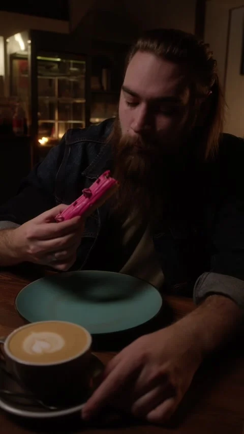 Brutal man eats eclair Stock Footage 223881831