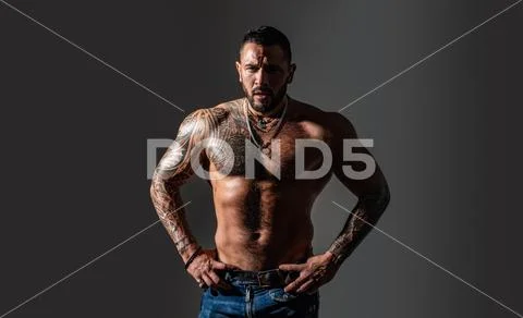 Brutal sportsman torso. steroids. sexy abs of tattoo man. male fashion. sport Stock Photos