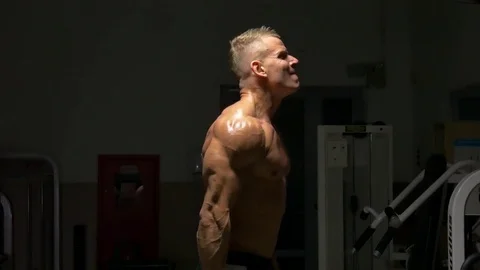 Brutal strong athletic men pumping up muscles workout bodybuilding Stock Footage 72077257