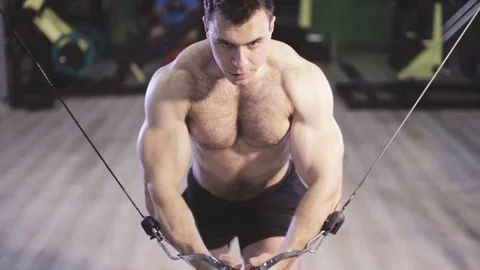 Brutal strong athletic men pumping up muscles and train in gym Stock Footage 80907238