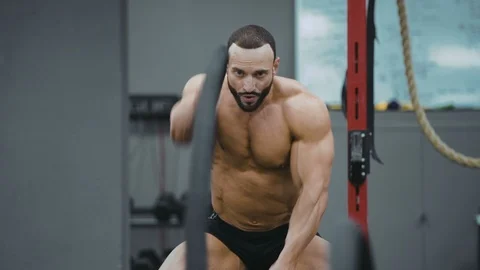 Brutal strong athletic men pumping up muscles workout bodybuilding Video stock 98458523