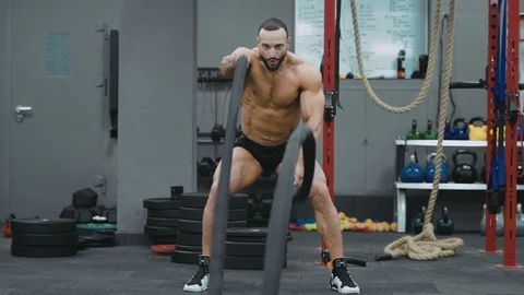 Brutal strong athletic men pumping up muscles workout bodybuilding Video stock 98458934