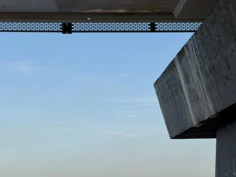 Brutalist concrete architecture with geometric forms under blue sky Stock Photos