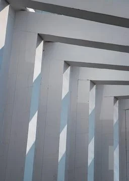 This brutalist-inspired structure elevates raw concrete through geometric r.. Stock Photos