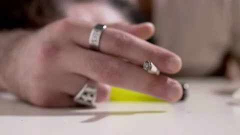 Brutalization, alienation - hand of stoned man holds a joint Stock Footage 197751620