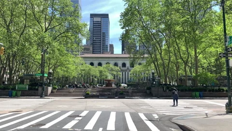 Bryant Park in Central NYC is almost entirely empty during the COVID-19 Pandemic Stock Footage 130877702