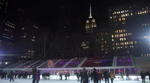 Bryant Park ice skating, winter ice rink with Empire state Building Video stock 47006745