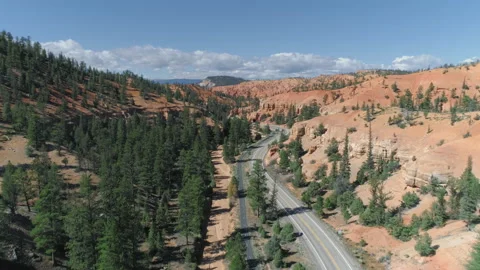Bryce canyon. 4K aerial over the road at beautiful red rock formations, Utah USA Video stock 134570856