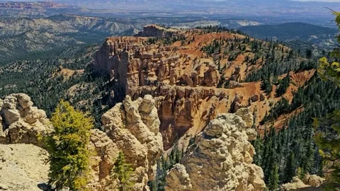 Bryce Canyon tilt up to distant valley Stock Footage 335239101