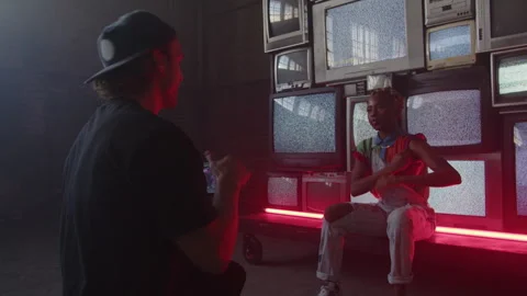 BTS of Camera Guy Directing Artist Sitting By TV's Stock-Footage 270327378