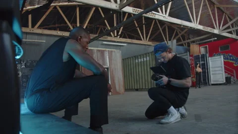 BTS Of Camera Man Getting Shot Of Sitting Artist' Stock Footage 270331116