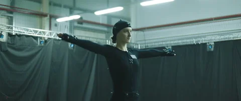 BTS - Female actor is standing in T-pose for calibrating motion capture software Stock Footage 166084341