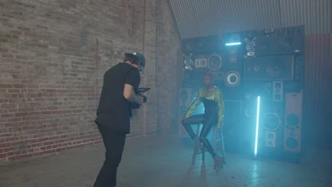 BTS Of Posing Artist Sits In Front Of Speakers While Being Filmed Видео 270327805