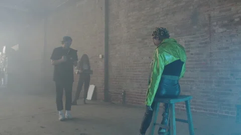 BTS Of Posing Artist Sitting On Stool For Shoot Video stock 270327848