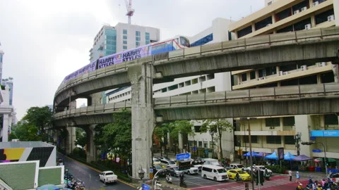 BTS sky train passing through Ratchaprasong intersection, Bangkok Stock Footage 231471431
