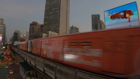 BTS sky train on rail at shopping district in Bangkok. Video stock 220378282