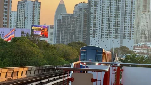 BTS Skytrain Approaching Bangkok Station Against Modern High Rise Skyline Stock Footage 345512399