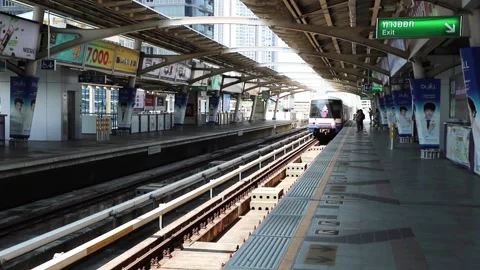 BTS Skytrain is approaching the station with passengers. Stock Footage 130181536