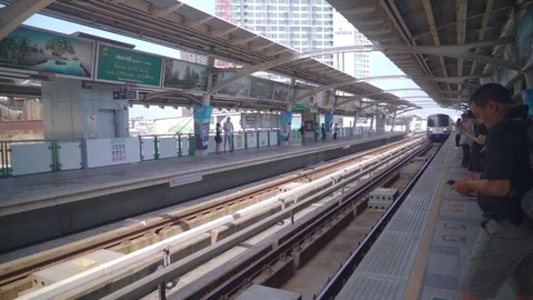 BTS Skytrain arrives at Trainstation Stock Footage 78612265