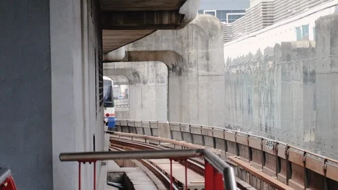BTS Skytrain arriving at Siam Station during rush hour Stock Footage 115960202