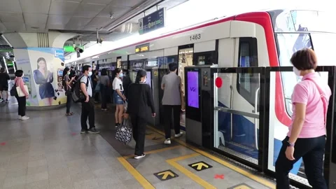 BTS Skytrain Bangkok passengers enter the train car and leave. Video stock 130185157