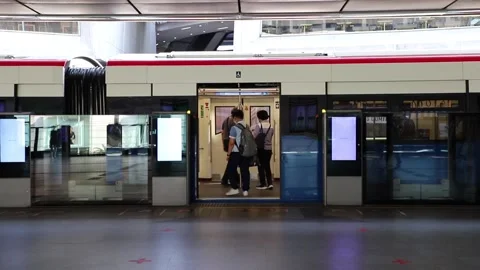 BTS Skytrain in Bangkok, passing train in the background of the city. Stock Footage 130185093