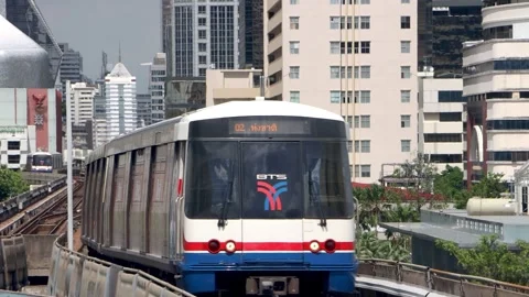 BTS Skytrain driving on elevated track with cityscape Stock Footage 342278158