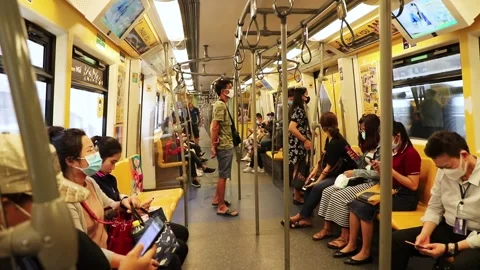 BTS Skytrain passengers in a subway car in Bangkok, people in medical masks. Stock Footage 130181465
