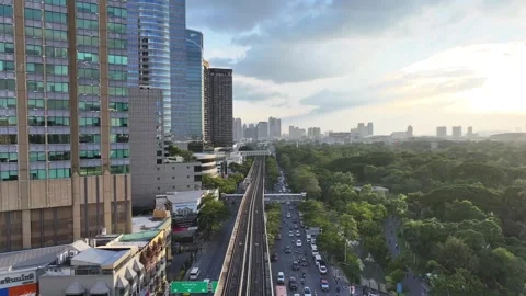 BTS skytrain rail line running above roads Stock Footage 333720804