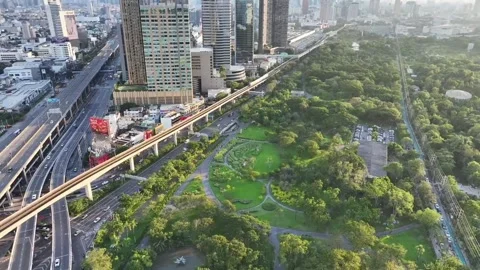 BTS skytrain rail line running above roads Stock Footage 333720806