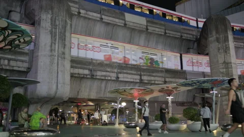 BTS Skytrains Crossing on Multiple Levels Above Pathum Wan Intersection at Night Stock Footage 328777692