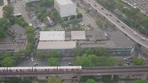 A BTS train passes along the elevated tracks Bangkok Stock Footage 308492296