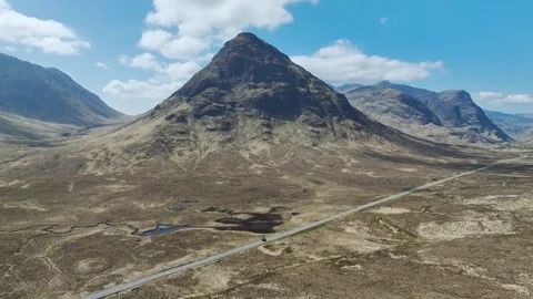 Buachaille Etive Beag and Three Sisters in Glencoe over Moors, Scotland, UK Stock Footage 308676022