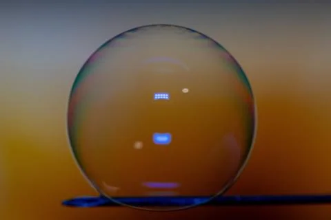 A bubble is about to pop on a needle. 스톡 사진