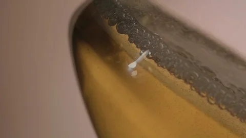Bubble and Drop in a Glass of Beer Stock-Footage 108048328