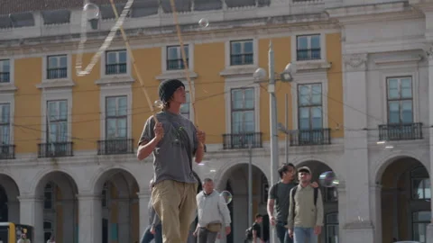 Bubble Artist Performs Captivating Displays in Lisbons Commercial Square Stock Footage 327741682