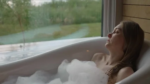 Bubble Bliss in a Nature View Bath Retreat Stock Footage 342224337