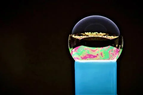 Bubble with blue abstract patterns on a dark background Foto stock