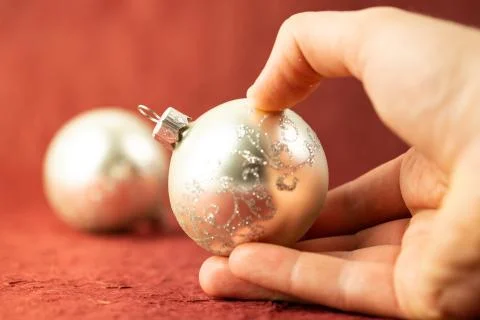 A bubble for a Christmas tree held in a hand. Christmas banner Stock Photos