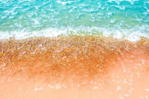 Bubble of clear sea wave on the beach Stock Photos