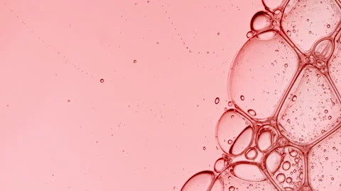 Bubble cluster, cells under a microscope. Transparent cosmetic gel fluid with Stock Footage 265903851
