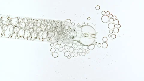 Bubble cluster, cells under a microscope. Transparent cosmetic gel fluid with Stock Footage 275961142