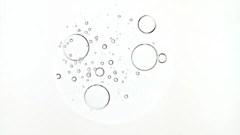 Bubble cluster, cells under a microscope. Transparent cosmetic gel fluid with 库存影片 276991883