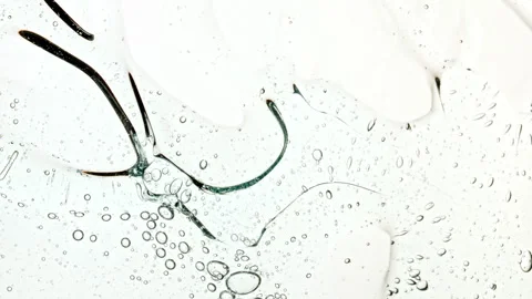 Bubble cluster, cells under a microscope. Transparent cosmetic gel fluid with Stock Footage 276994207