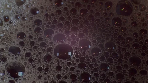 Bubble foam in a dark liquid Stock Footage 116903011