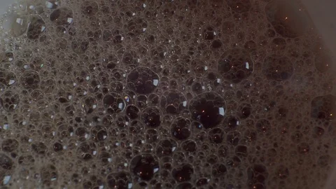Bubble foam in a dark liquid Stock Footage 116903121